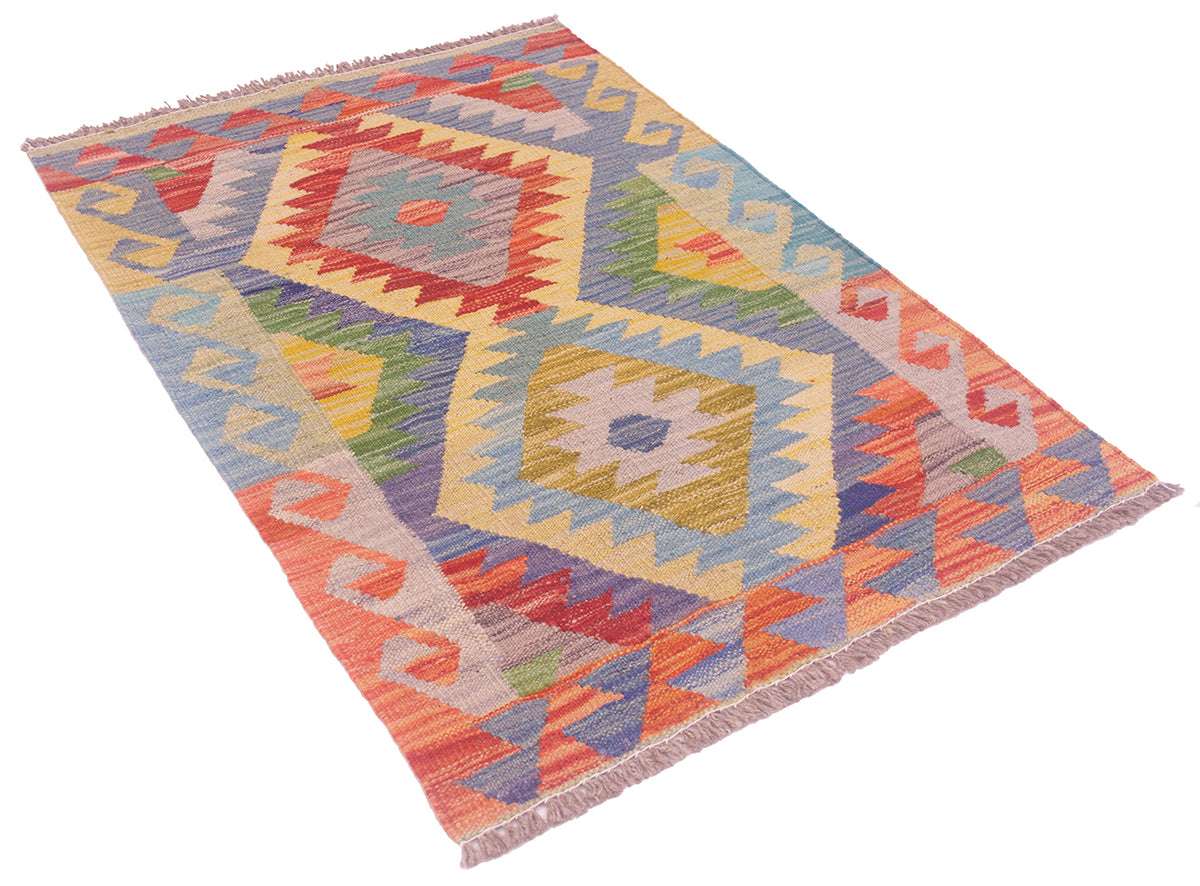 A small woven kilim rug with a colourful geometric diamond pattern, featuring fringe on two short ends, shown on a plain white background.
