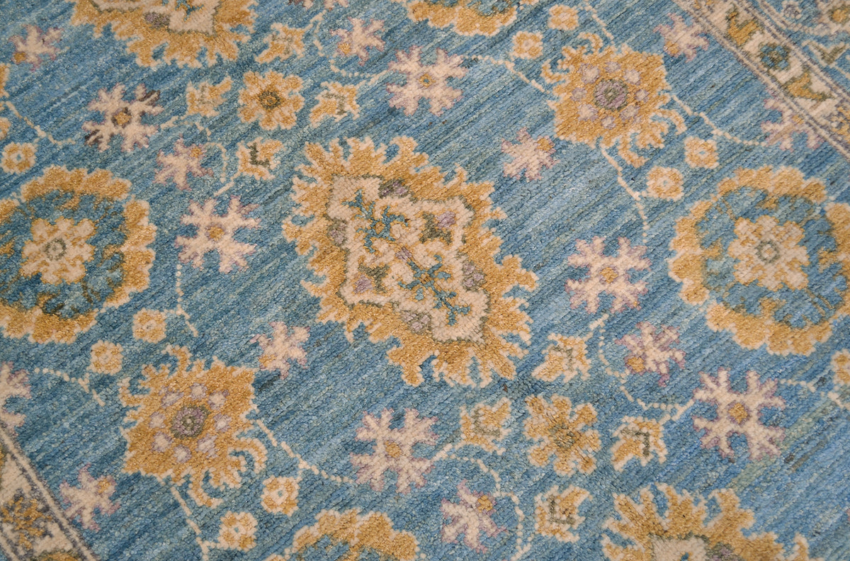 Detail of handwoven field of OUshak Carpet with palmettes and rosettes