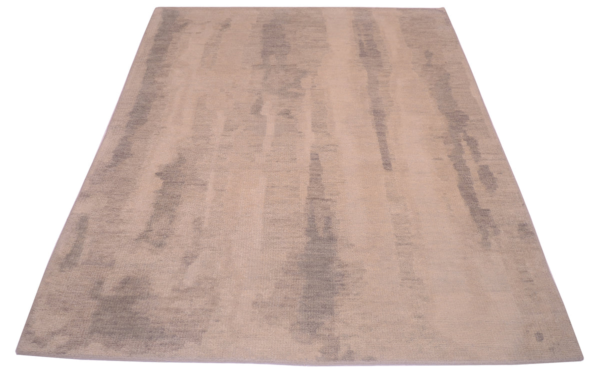 Overall view of abstract modern carept woven in Indian with wool pile woven on cotton foundation. Nuanced, softened neutral pastel tones in grey and beiges.