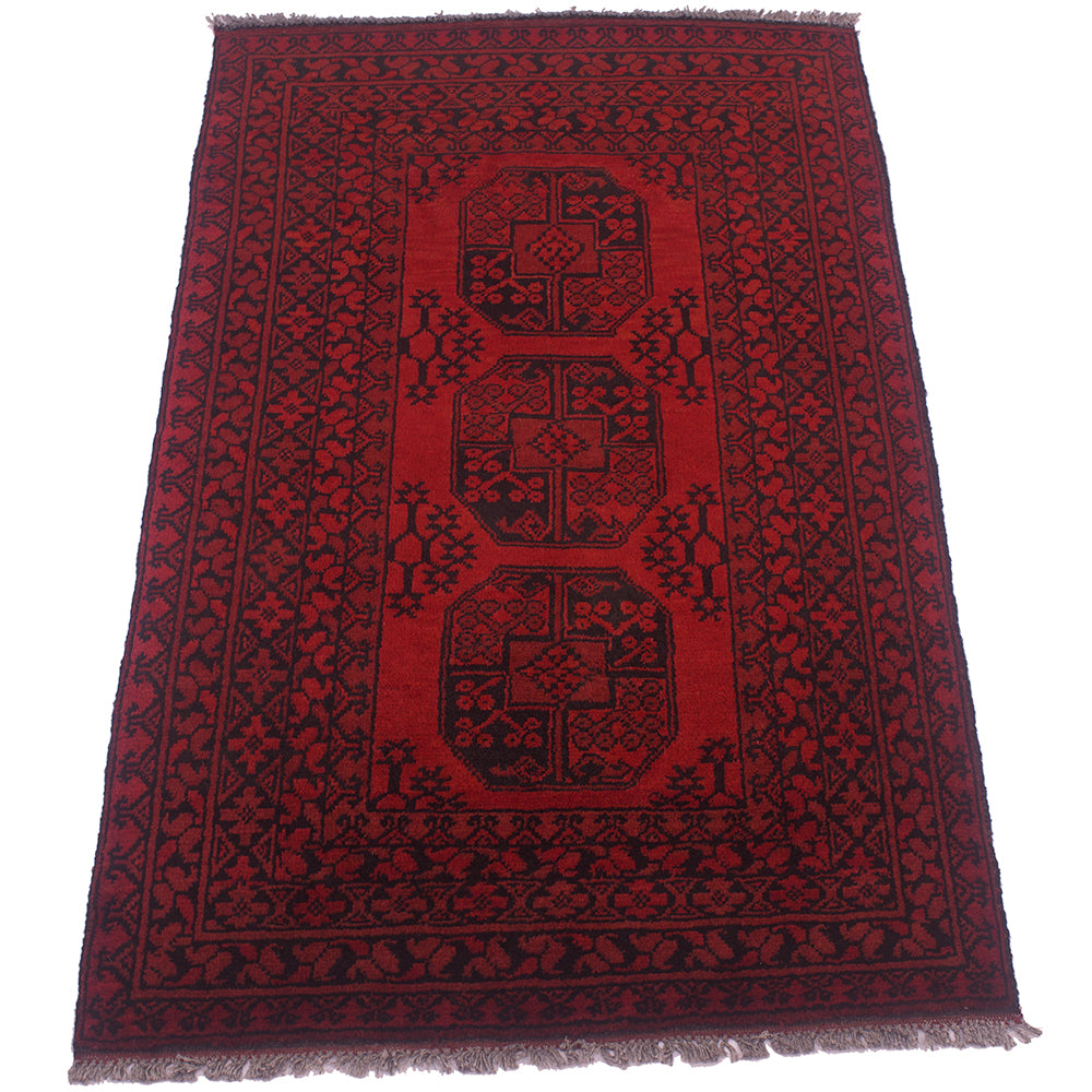 A traditional 5x3 oriental Red and black Afghan rug with a deep red and black geometric pattern, featuring a central vertical panel with three large guls and a detailed floral border.