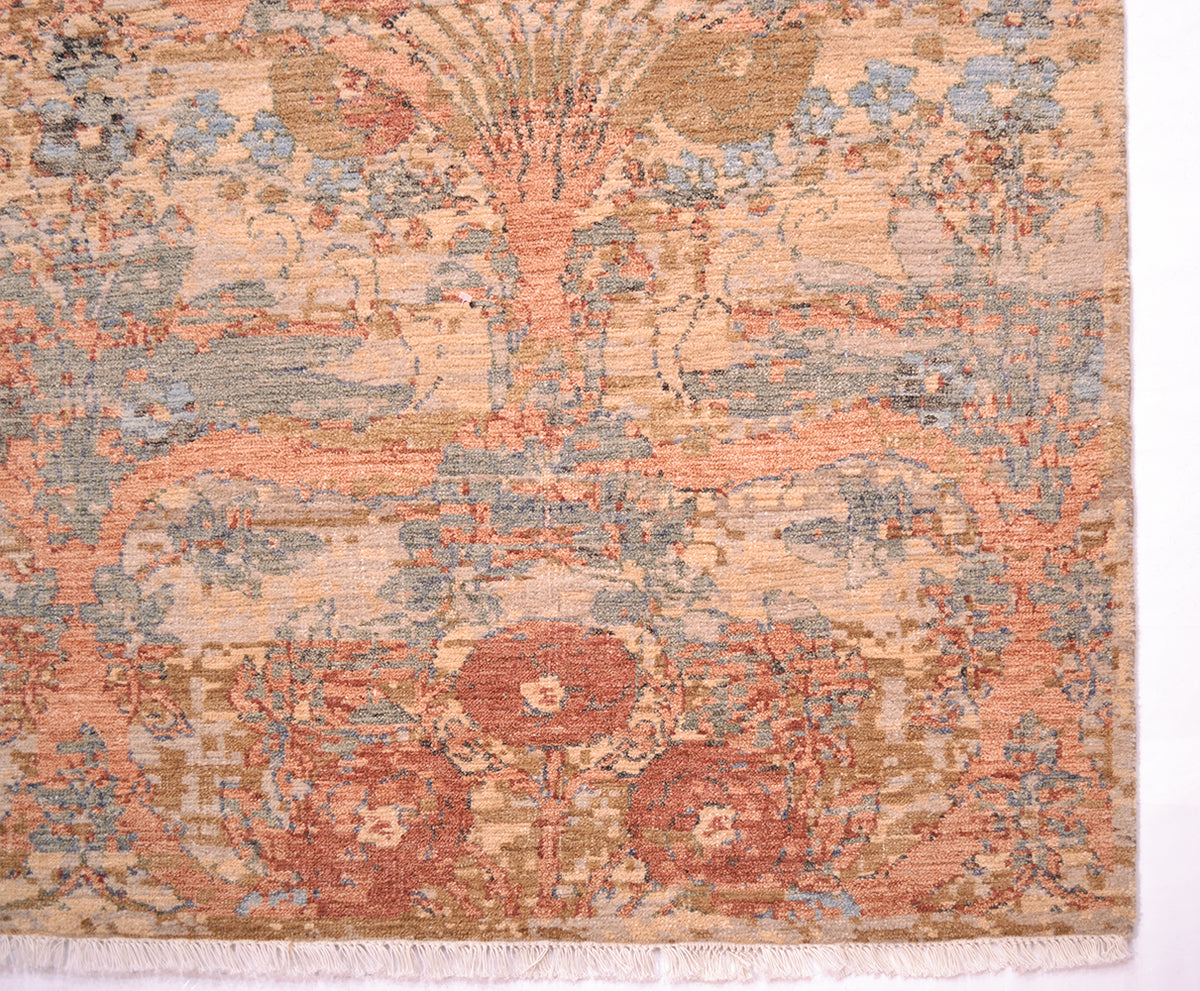 Corner detail of arts and craft flourishing carpet with interconnecting floral sprays, leaves and blossoms. Light blue and sea green secondary colours with gold and terracottas.