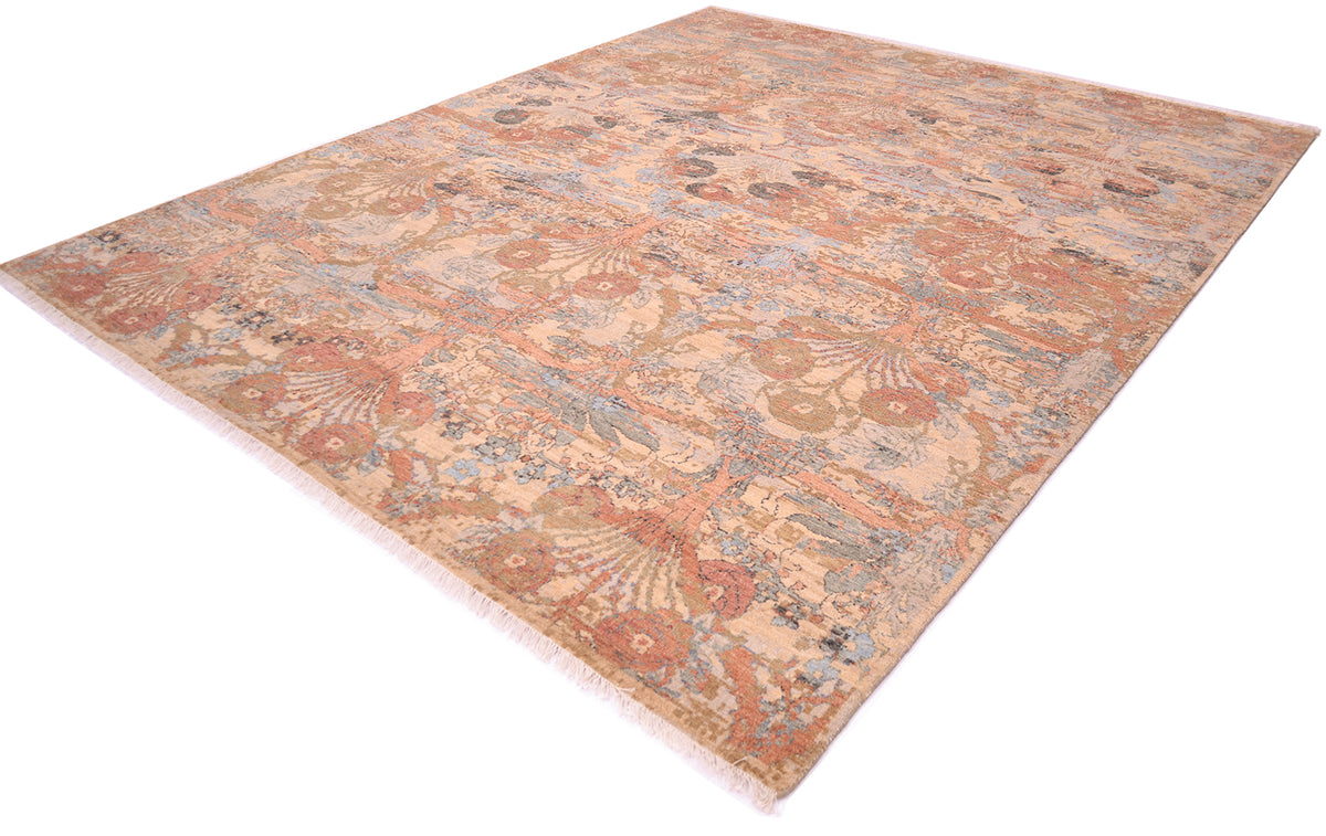 Angled view of soft coloured carpet with floral bouquet motifs with terracottas, light blue, greys and golds. Nuanced tones with softened detailing. Floral sprays all over floral design.