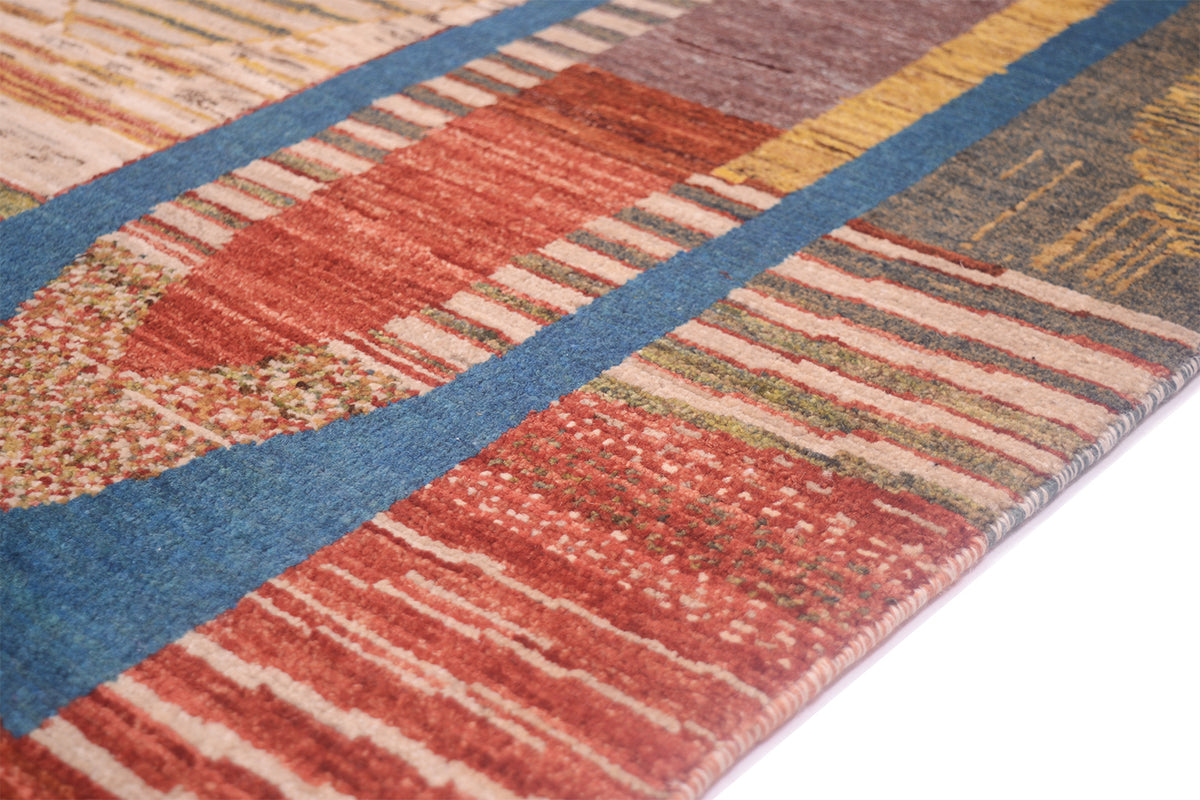 Close up detail of neattl bounds sides of fine afghan aryana carpet with modern abstract design. Natural vegetable dyes and handspun wool. Striped areas of design.
