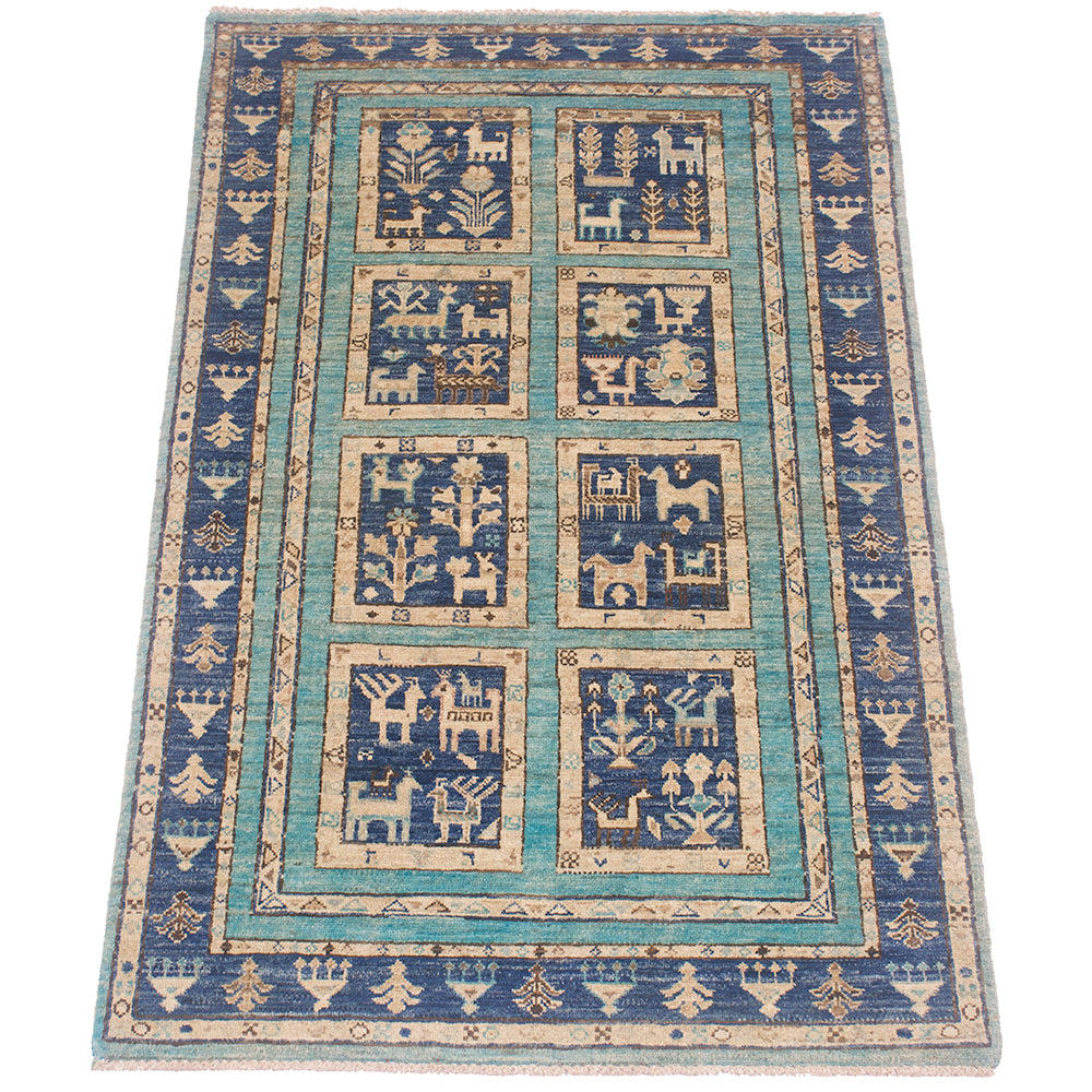 A 5x3 rectangular Afghan Aryana Rug with a traditional tribal design, featuring a turquoise and navy blue centre field with geometric and animal motifs, surrounded by a beige and blue patterned border.