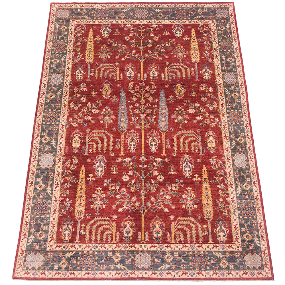 A traditional Pictorial fine Aryana Carpet with a deep red field, featuring a central tree motifs and ornate floral patterns in beige, blue, and gold, surrounded by a detailed green border.