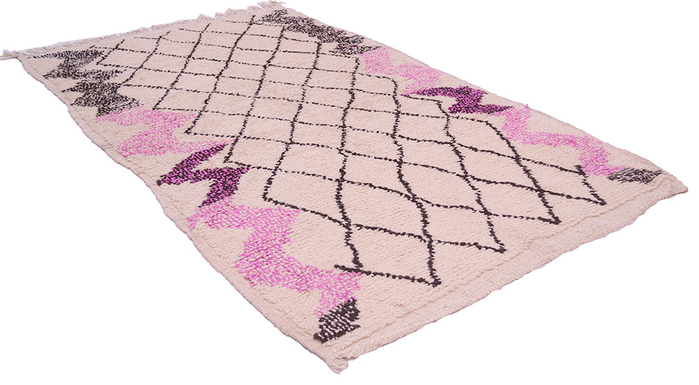 Azilal vintage rug, light pink with black line diamonds and magenta highlights, angled view.