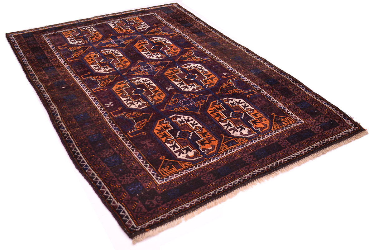 A rectangular traditional Old Afghan Baluchi rug with a dark navy and brown field, featuring large central gul motifs in orange, beige, and brown, finished with a fringed edge.