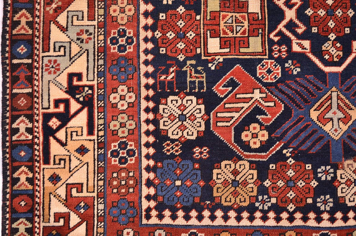 Antique Shirvan rug with red, blue, and cream geometric motifs border