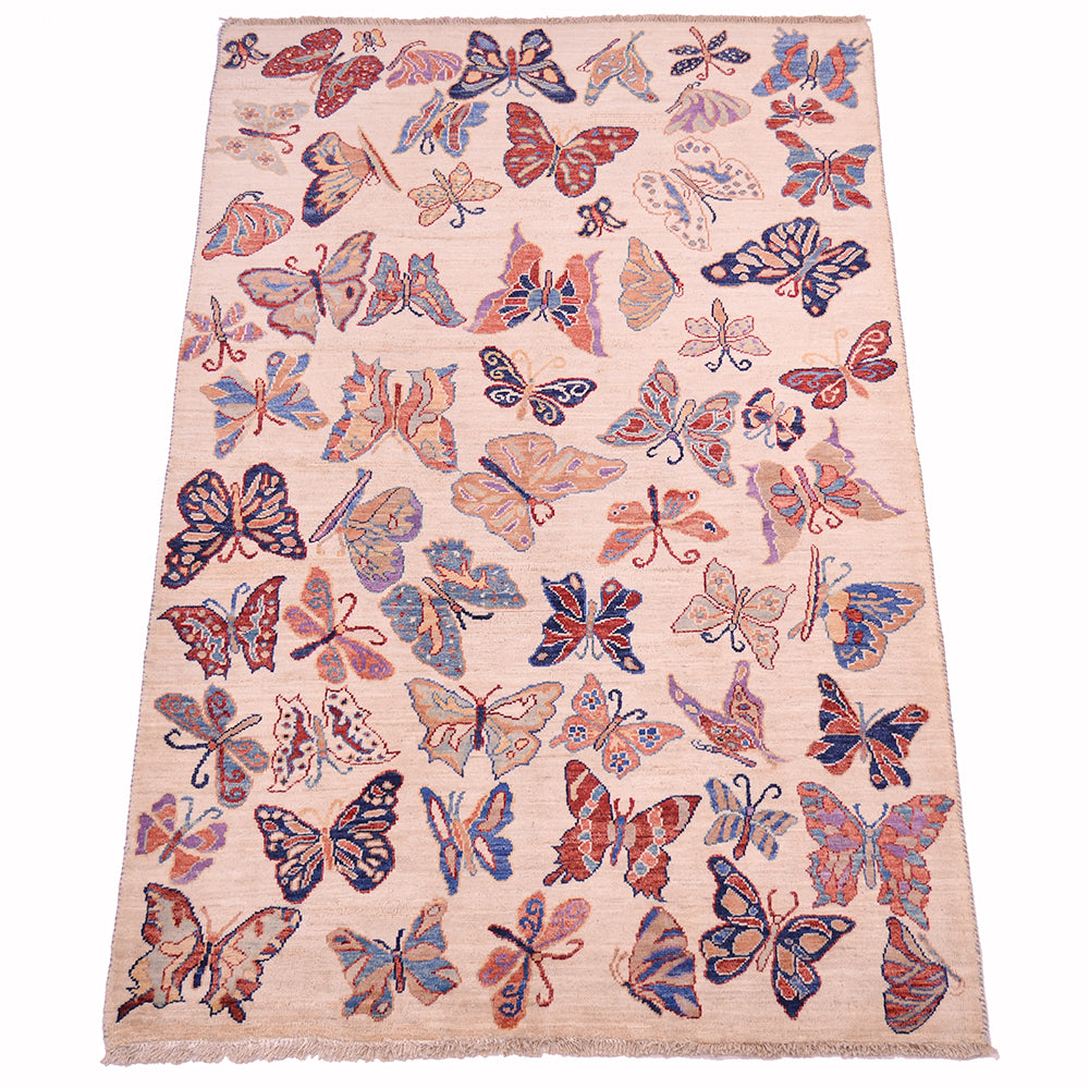 A 6x4 rectangular Afghan area rug with a light beige background and an all-over pattern of coloruful butterflies in shades of blue, red, and orange, finished with a fringed edge.