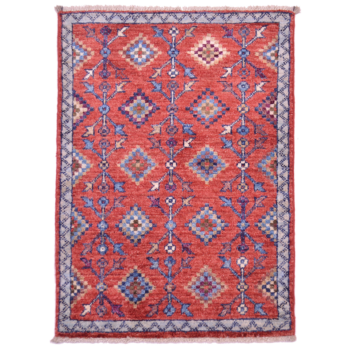 Afghan Chobi tribal design mat with rust-red main colour and all over geometric pattern.