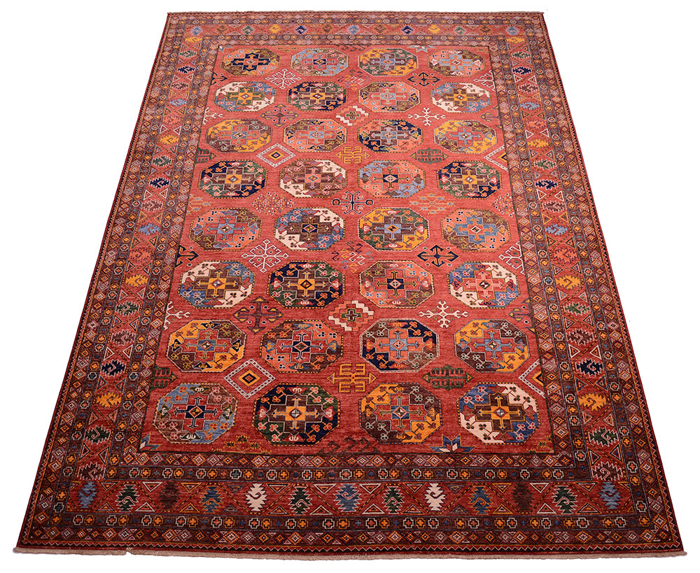 A 14x10 traditional hand-woven Afghan Ersari area rug with a rust field, featuring a repeating pattern of octagonal medallions and a detailed geometric border in shades of blue, yellow, black, and white.