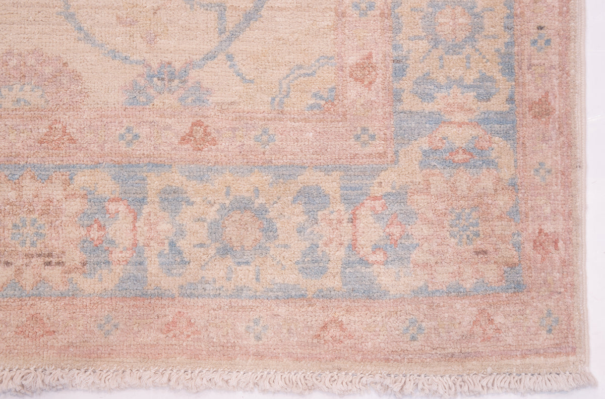 Detail of corner and border ofhandmade runner with pure wool pile and cotton warp fringe. Floral bordermain border and minor borders.