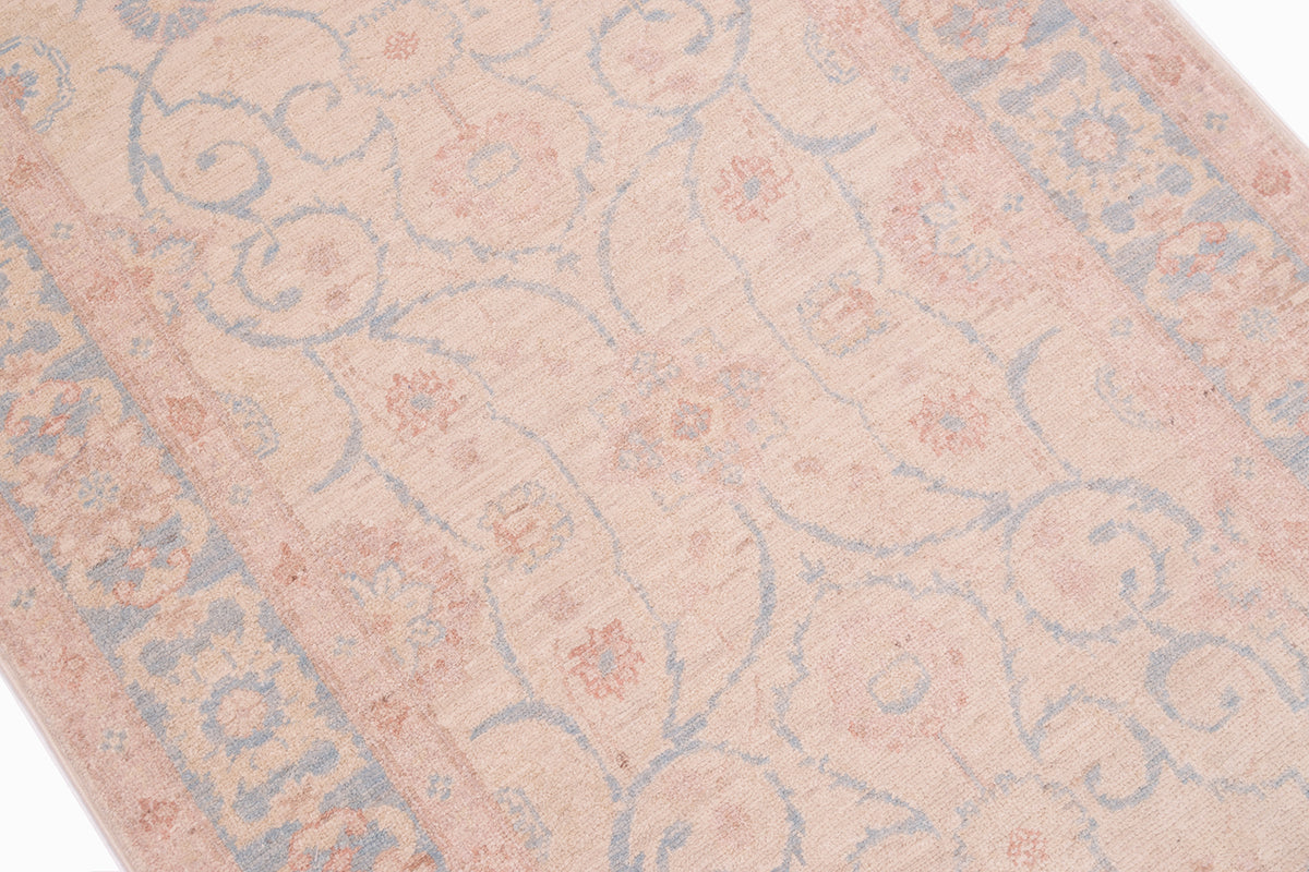 Close up detail of Afghan Feraghan design runner with elegant soft palette with pure wool pile. Curling arabesque tendrils and floral blossoms fill main field.