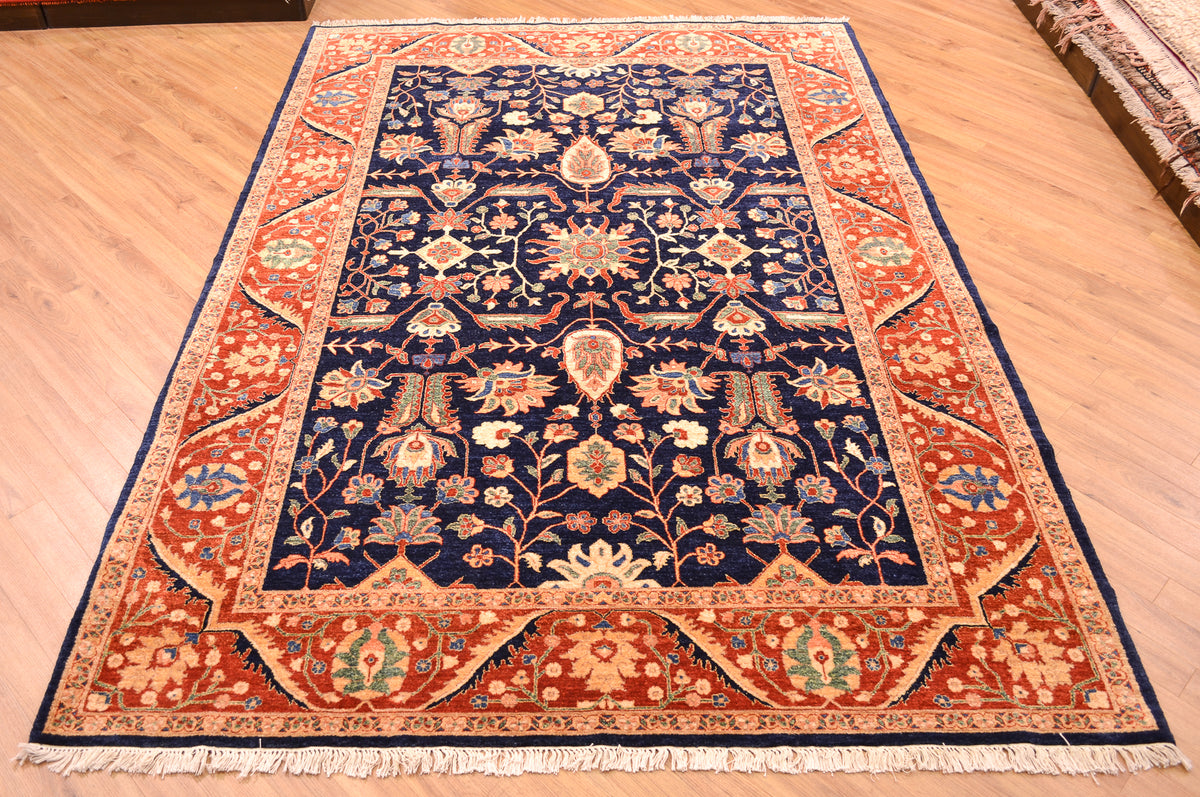 Fine Ferahan Carpet with dark blue background with contrasting floral pattern surrounded by a rust border with hints of blue, green and golden tones. Woven on a cotton foundation.