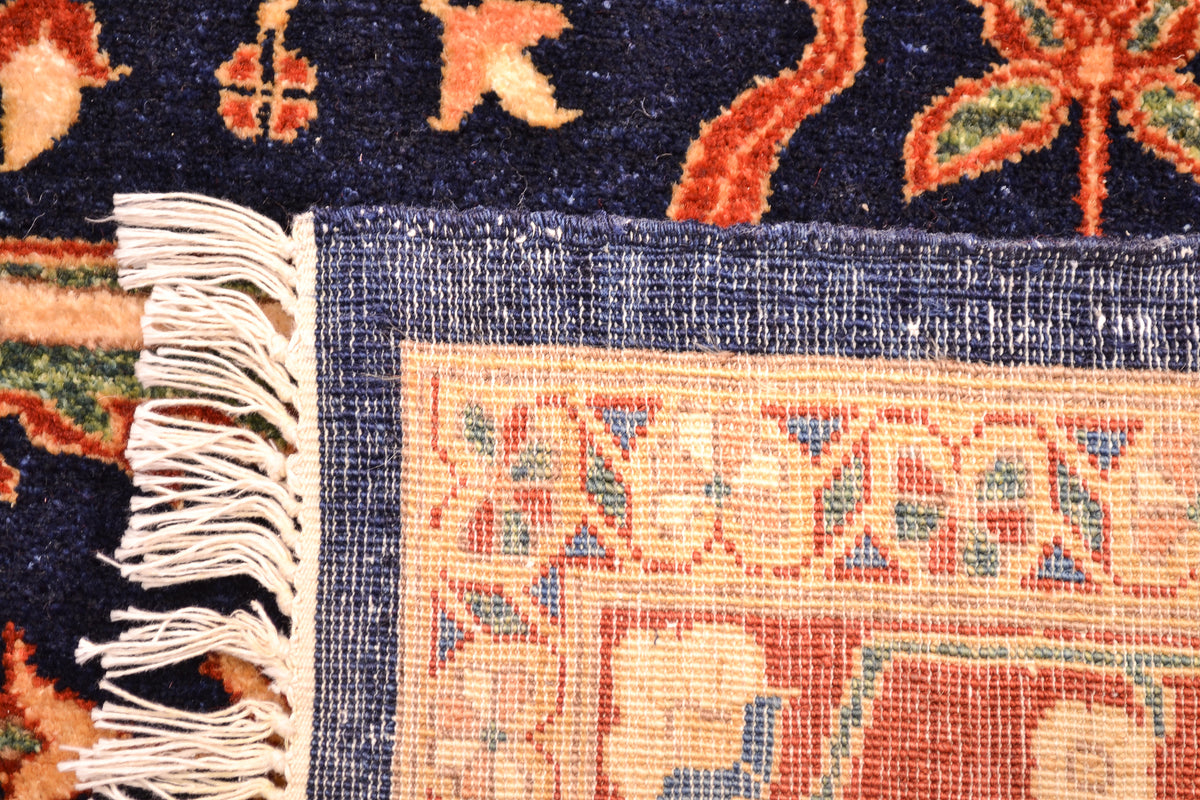 Reverse of caretp showing fine knotting of Feraghan design floral carpet handknotted in Pakistan Afghanistan border. Finely woven with natural vegetable dyes.
