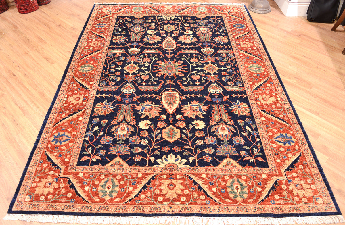Fine handmade Ferahn design carpet handknotted in Pakistan with all over tradittonal floral classic design ...hints of midnight blue, golden ivory cream, light green, sea blue as well as a rust-amber background colour to border.