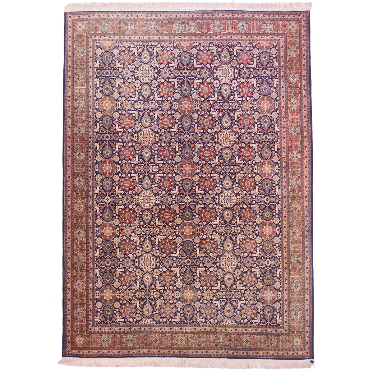 Faded Turkish old Hereke carpet with all over floral design set on a navy blue field.