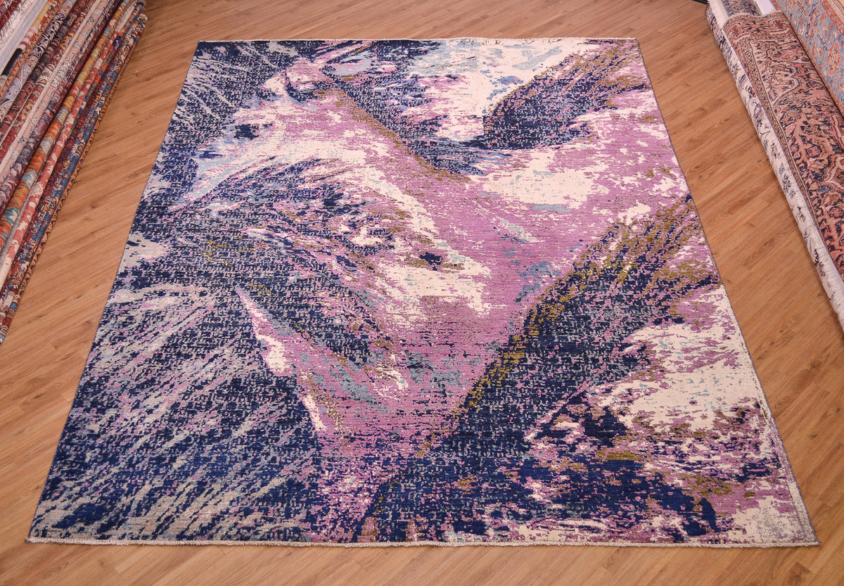 Stylish modern Abstract Himalaya carpet hand-knotted with mauve purple, light and dark blue wool, touches of olive green as well areas of white viscose silk. Broad gestural design.