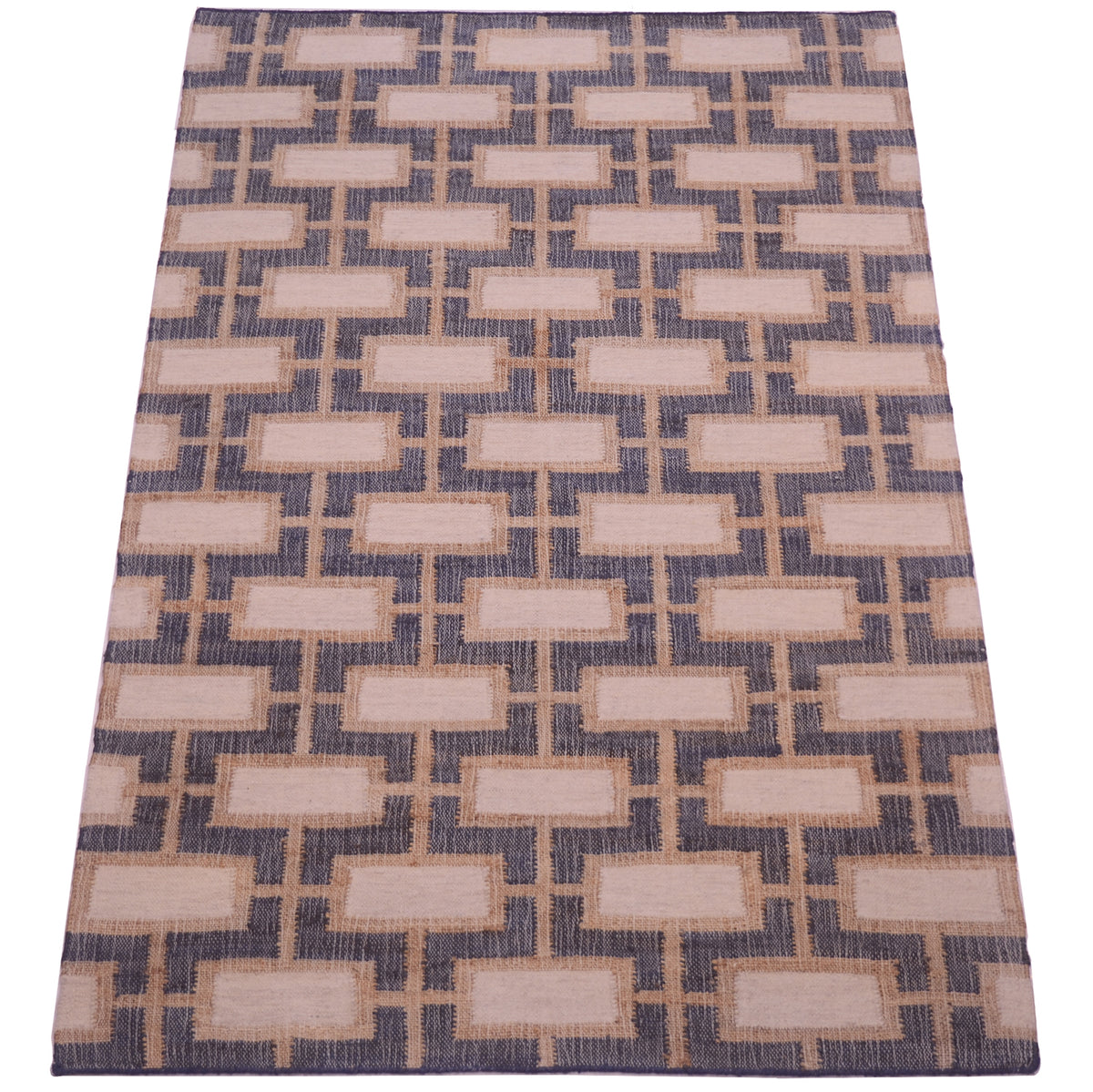 A rectangular area rug with a geometric pattern of beige rectangles on a textured navy blue background.