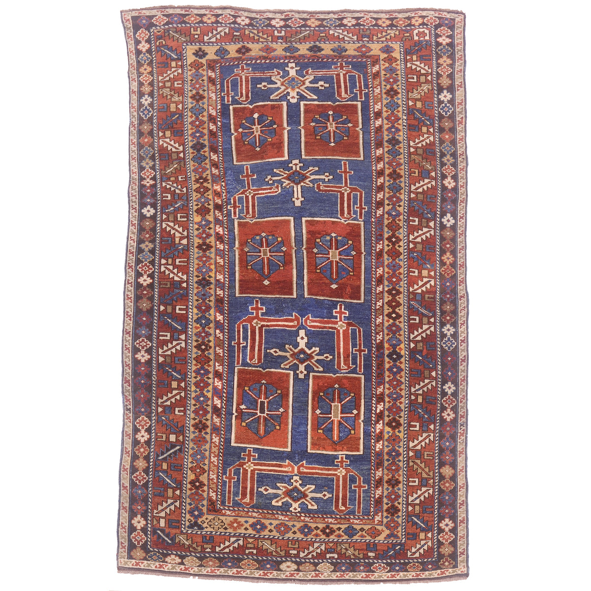 Blue ground with rust, cream & gold antique karagashli rug with geometric design.
