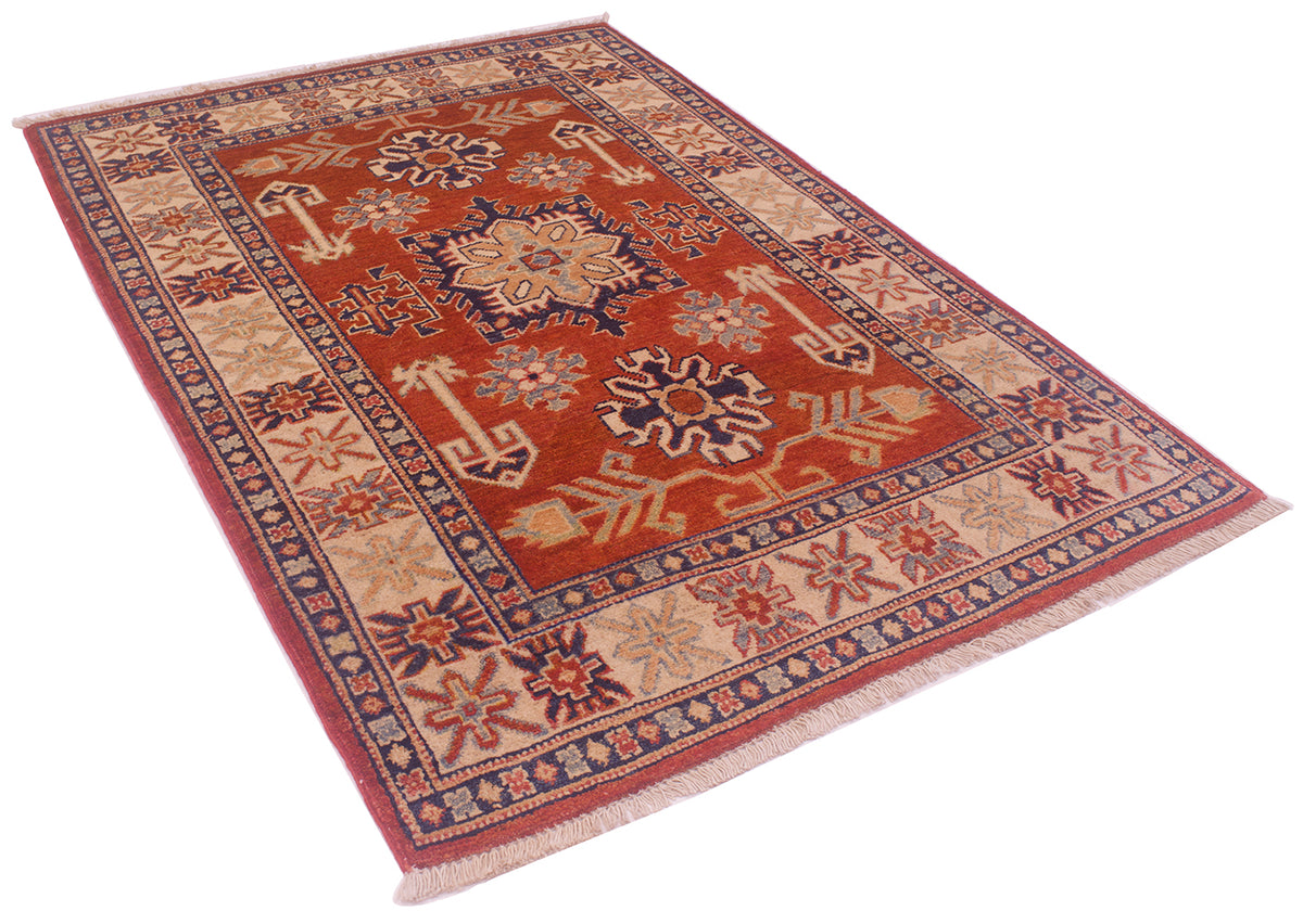 Handmade Kazak rug laid diagonally, rust-red central medallion with patterned border