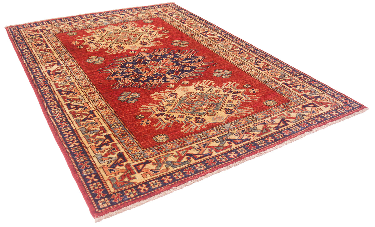 A traditional oriental Afghan kazak rug with a red field, featuring intricate floral medallions and a detailed patterned border in navy blue, beige, and rust red, shown on a plain white background.