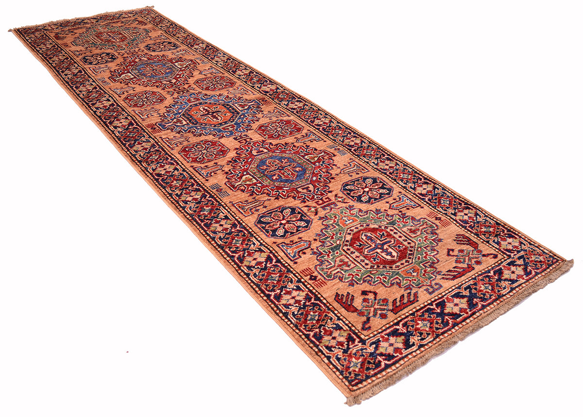 Fine Kazak Peach colour Handmade runner with a warm peach base, featuring intricate navy blue, red, and beige floral medallions and geometric borders.
