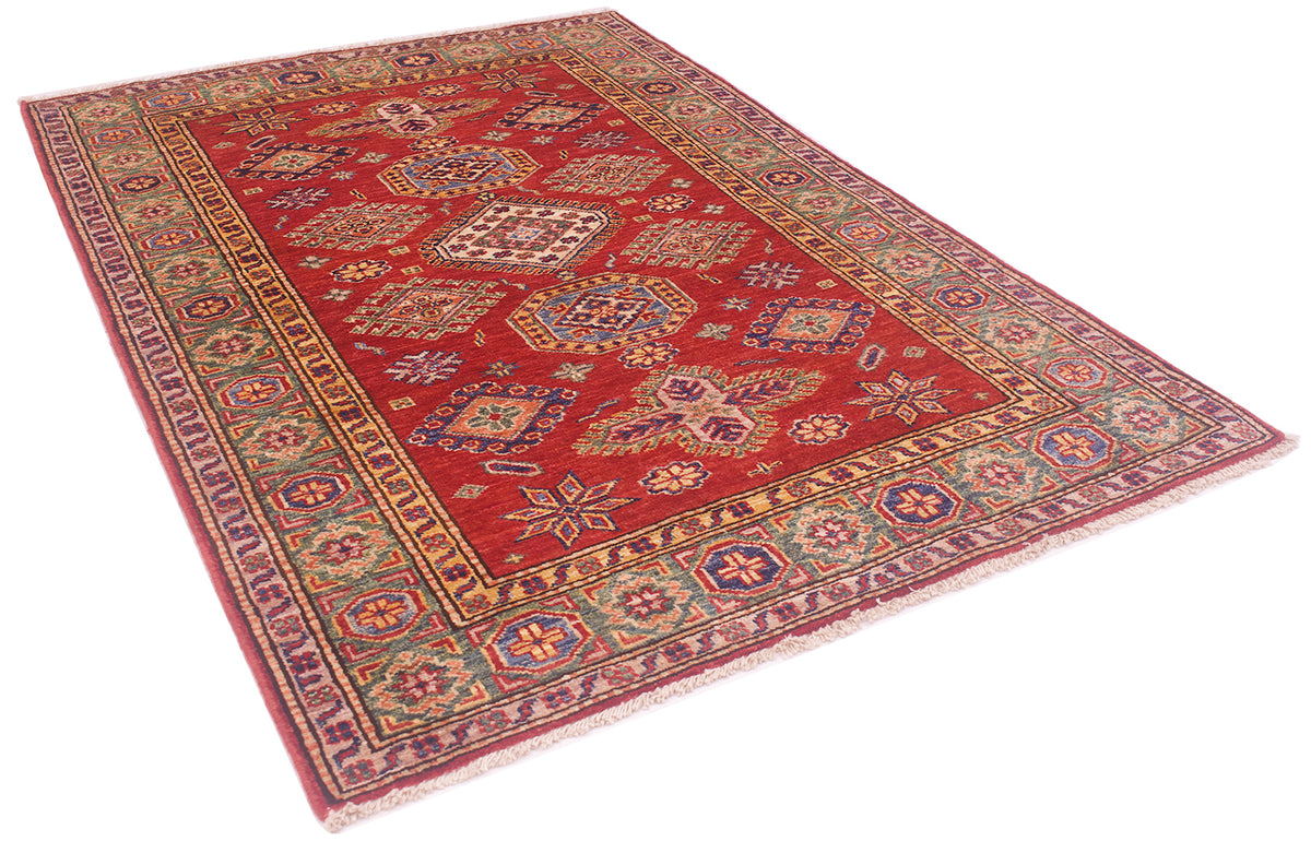 A traditional oriental area Afghan rug with a red field, intricate geometric medallions, and a detailed multi-colored border, shown from an elevated angle on a white background.