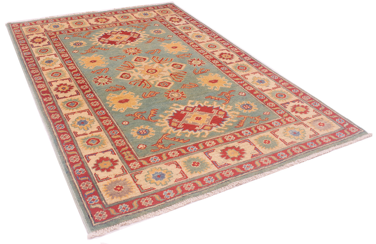 A rectangular Afghan Kazak rug with a traditional geometric pattern, featuring a muted sea-green centre field, red borders, and beige and orange floral medallions, shown on a plain white background.