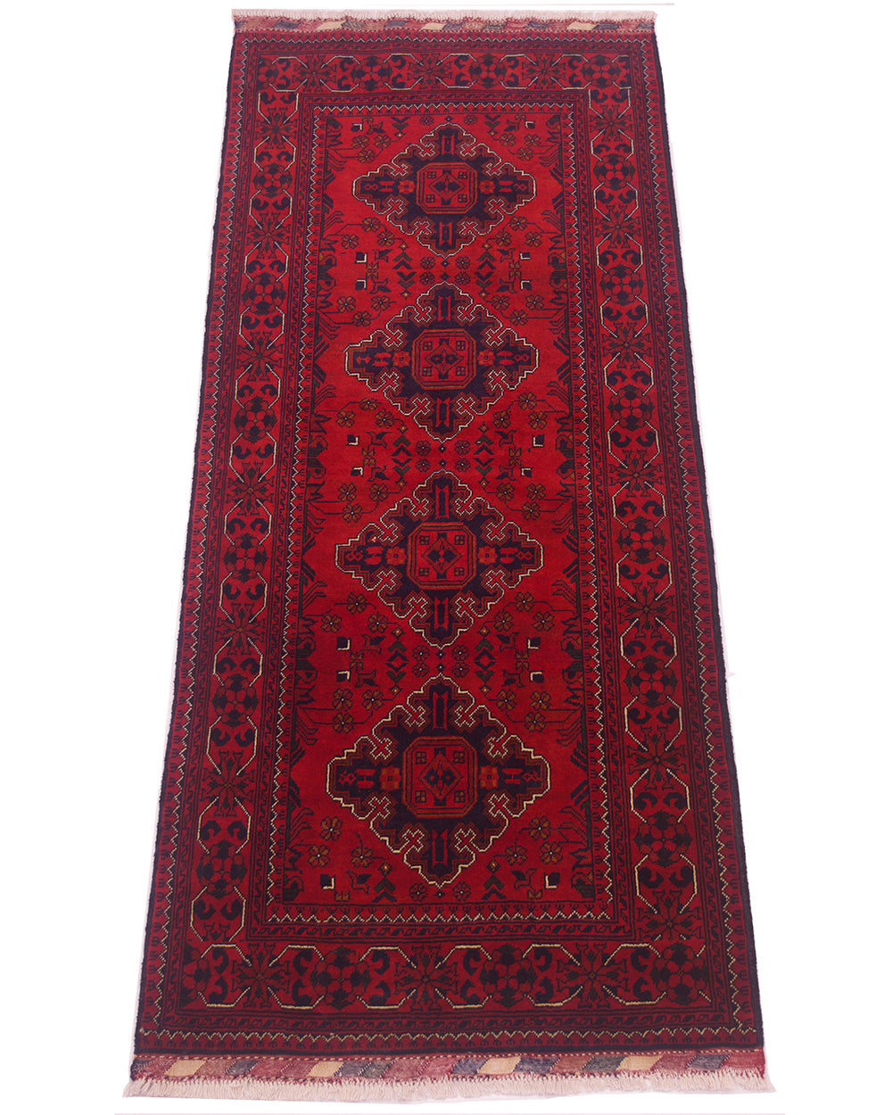 A traditional afghan runner rug with a deep red field, featuring four central medallions in dark navy and black, surrounded by a patterned border and fringed ends.