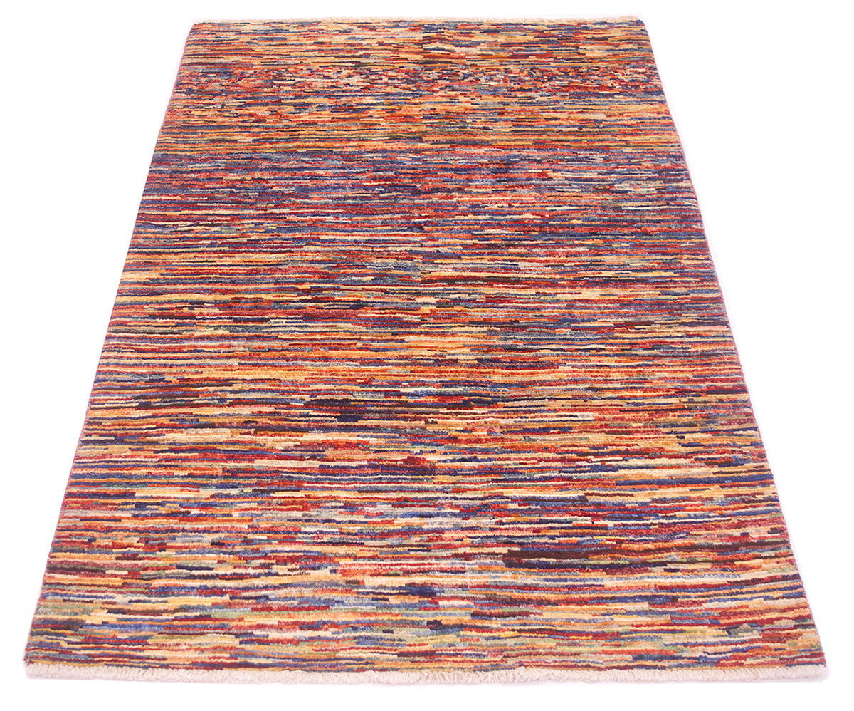 A rectangular handwoven modern Afghan stripy Gabbeh rug with a dense, textured horizontal stripe pattern in a multicolour palette of rust red, orange, blue, purple, and beige, shown flat against a white background.
