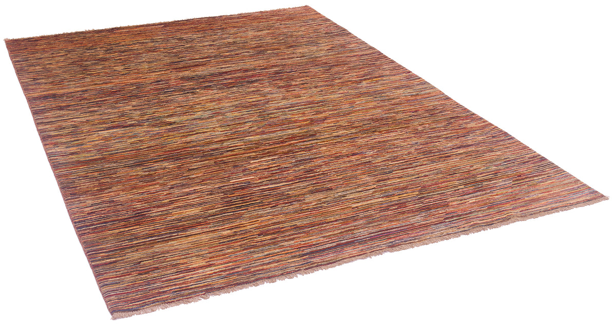 A rectangular woven modern Gabbeh area rug with a textured, rustic pattern in earthy tones of brown, rust, orange, and muted red, shown at an angle on a white background.
