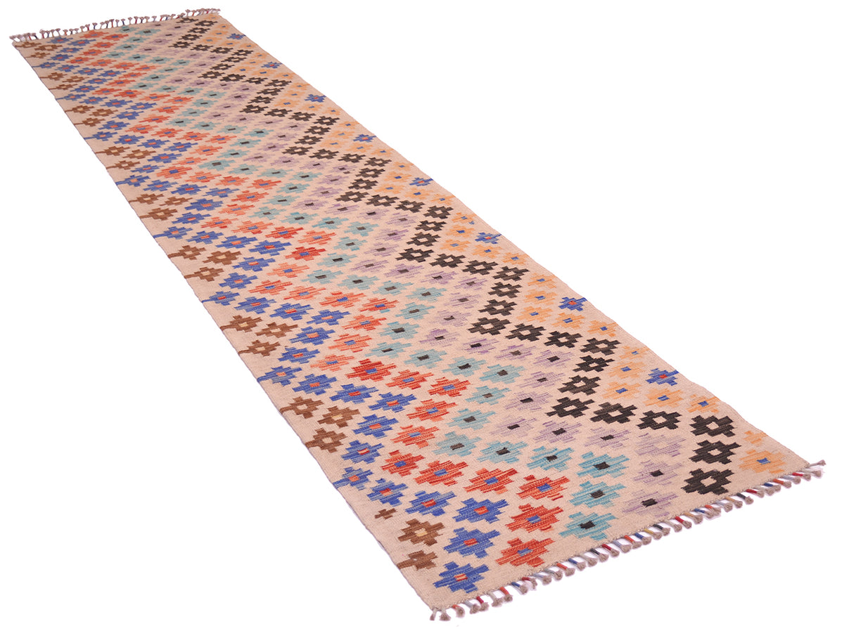 A 13' long rectangular woven Long multicolour Afghan Kilim Runner rug with a geometric pattern in muted blue, orange, brown, black, and light blue on a warm beige background, finished with wrapped fringe on both ends.
