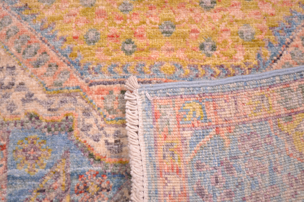 Rerves of hand crafted and hand knotted afghan runner in light colours.