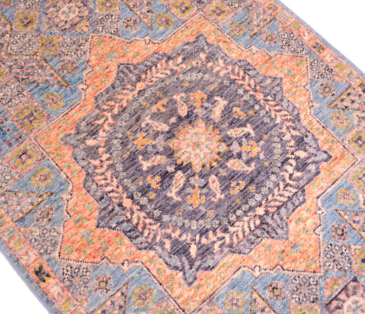 Detall of focal point of mamluk runner with distinctive central medallion.