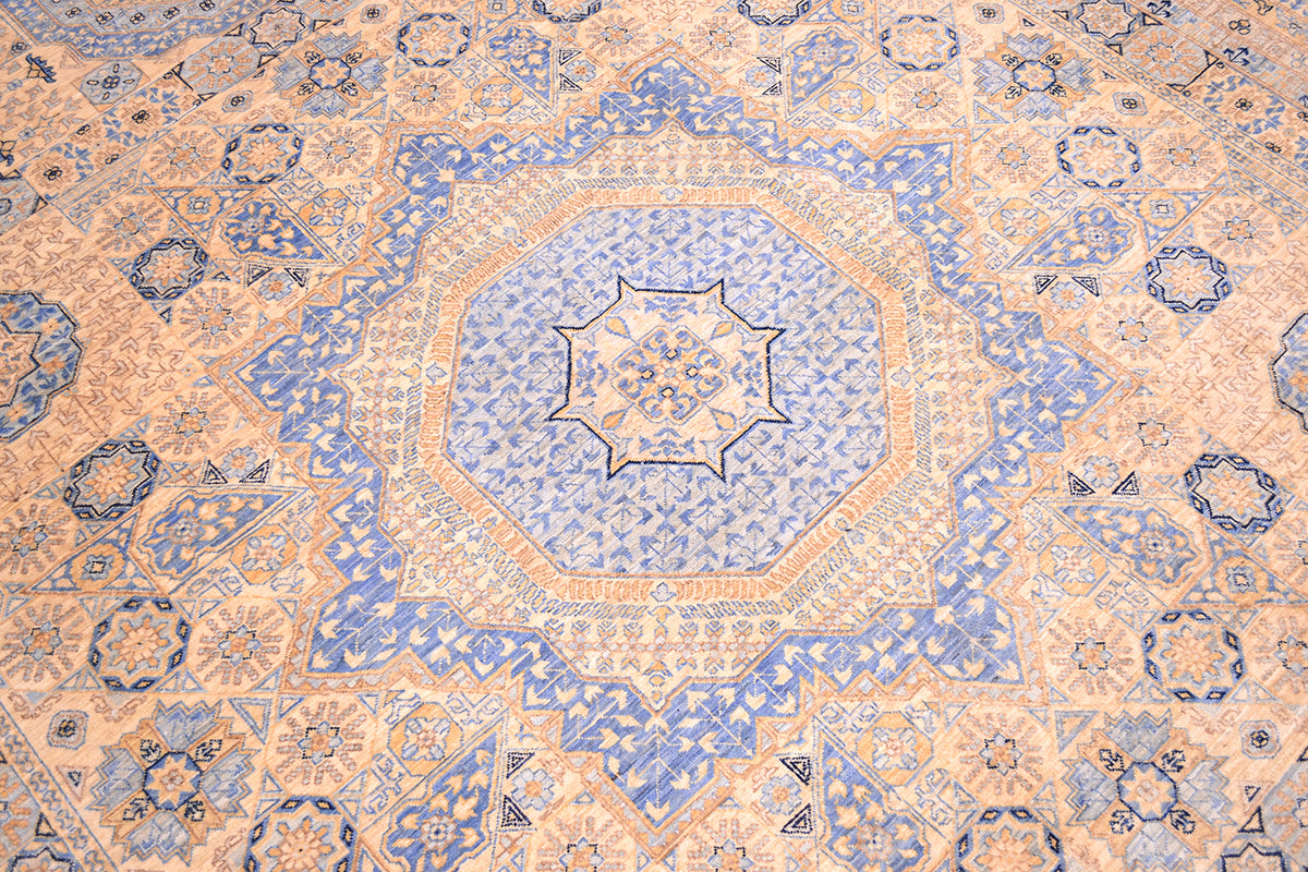 Mamluk medallion detail in sky blue and cream centre of handwoven carpet