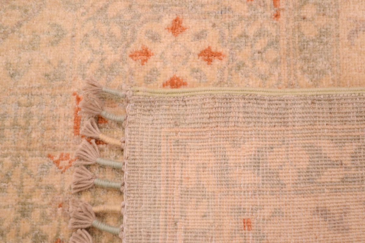 Reverse of knottted pale carpet with bound warps with cream and duck egg blue