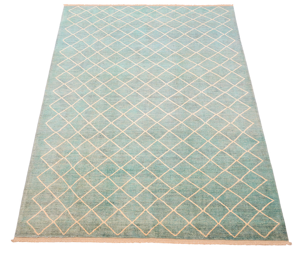Overall view of modern carpet wth oure wool pile woven on cotton warps. Topaz and sea green-blue turquoise main field colour with natural cream/ beige lattice design.
