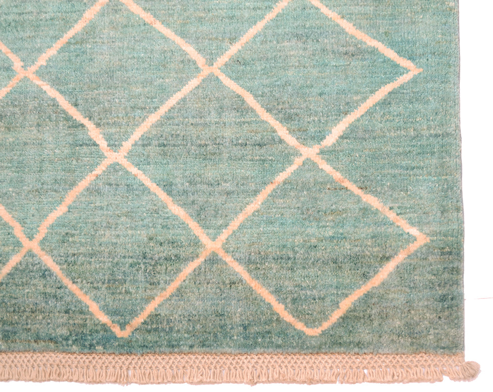 Corner detail of Afghan modern carpet with latticed matelasse design and latticed cotton warp threads.