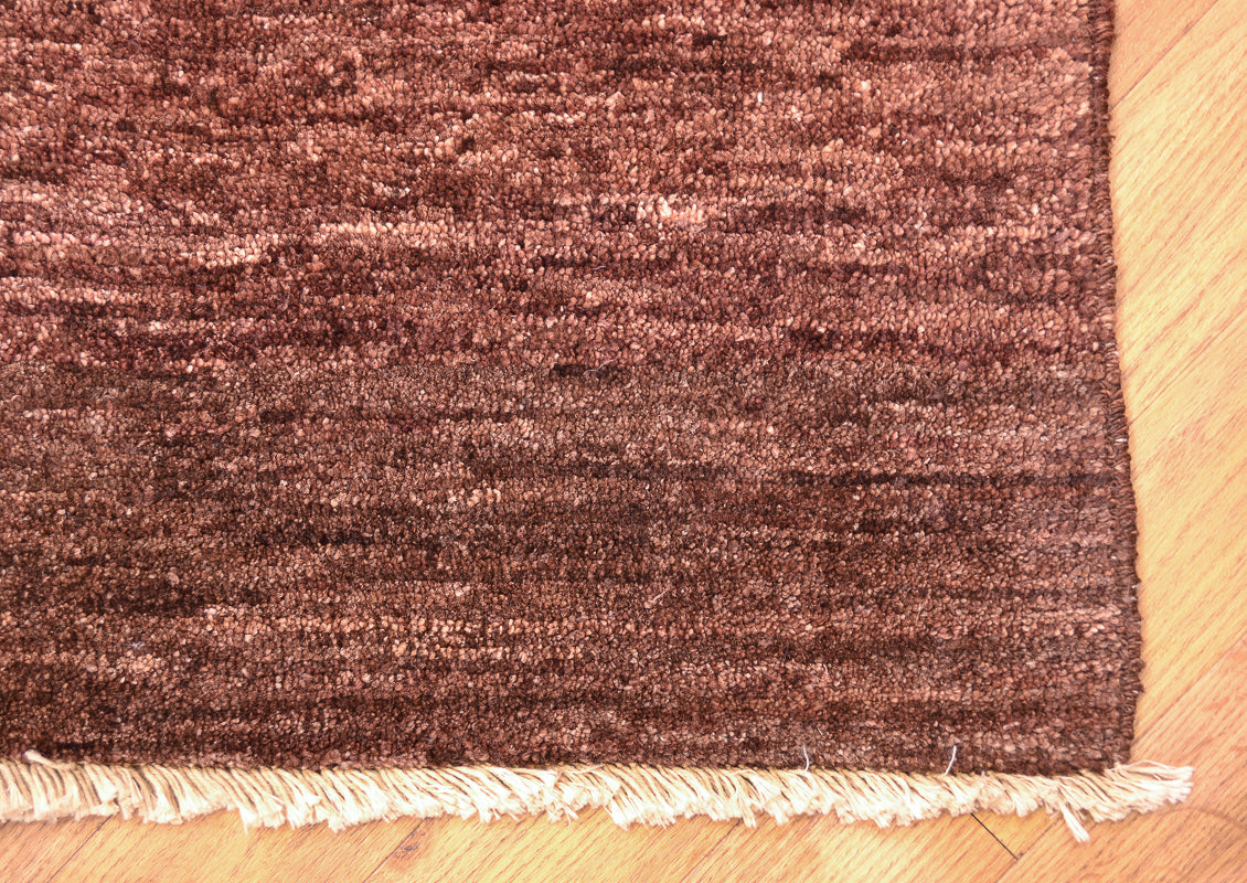 Handmade and hand-knotted Modern design Afghan Chubi Carpet with parqueted central design and wide brown plain border.