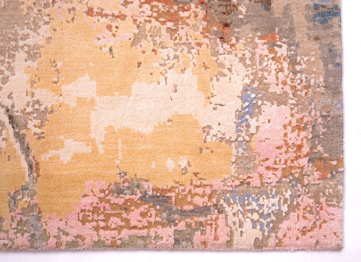 Detail of eroded look of abstract modern carpet with cream and gold highlights. Finely knotte with a background of pure wool pile.