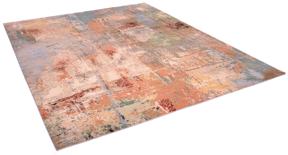 Angled view of modern abstract expressionistic carpet with pure wool and silk pile. Variety of warm and cool tones of greens, blues and terracottas. Hints of deep red and black. Cream ivory white silk areas.