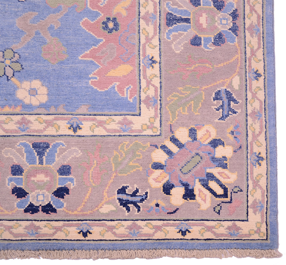 Corner design and border of handknotted blue and grey afghan carpet with cotton warps