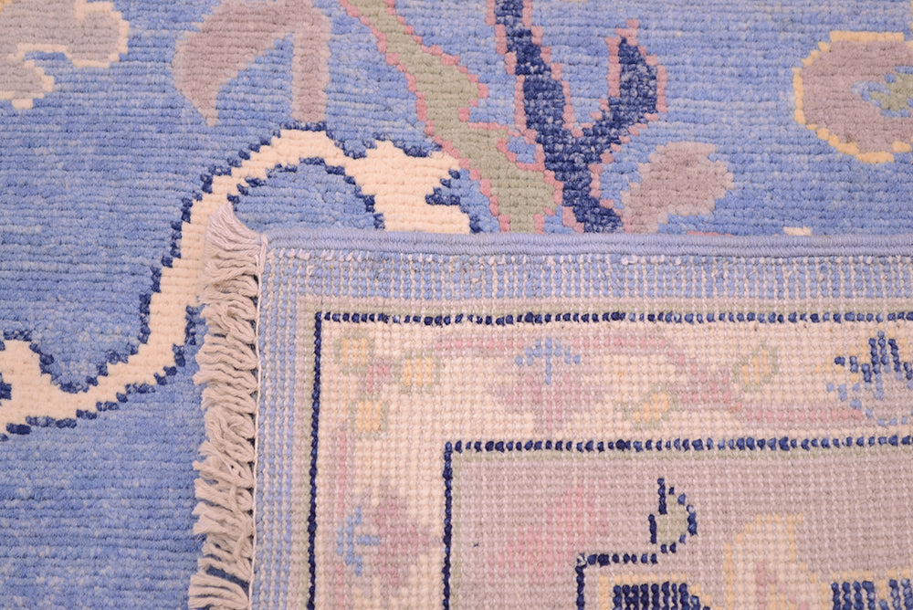 Reverse of carpet handknotted in Afghanistan. Contemporary Ushak carpet with blue field.