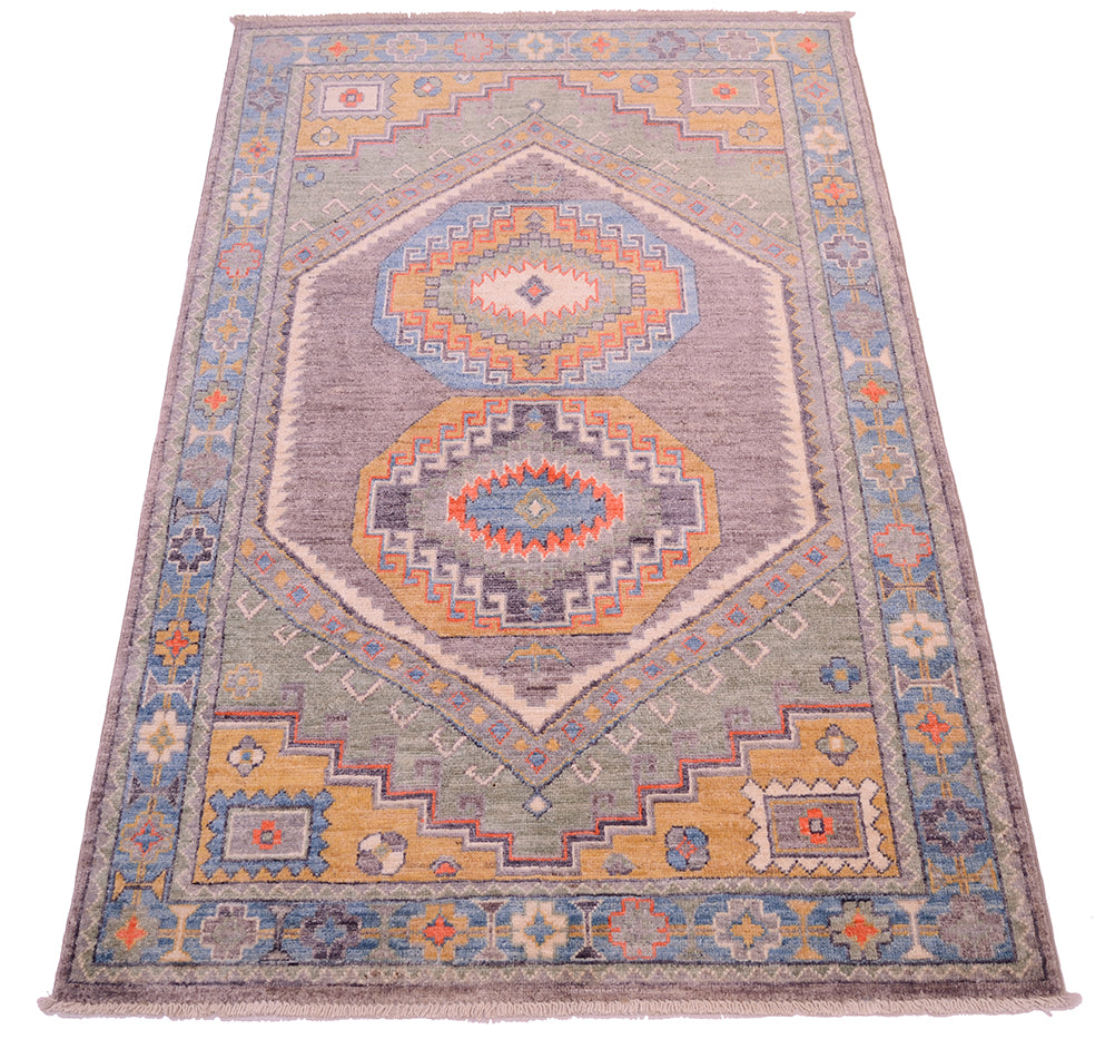Geometric field and border of handknotted Oushak Rug