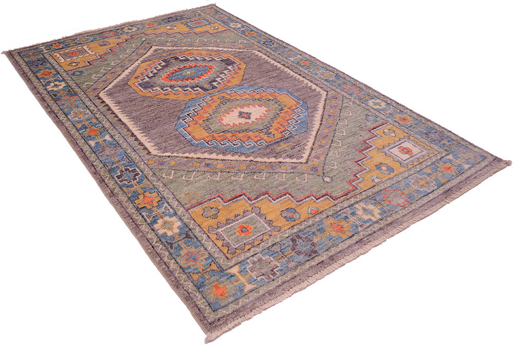 Angled view and rich grey and striking colours of handknotted Ushak Rug