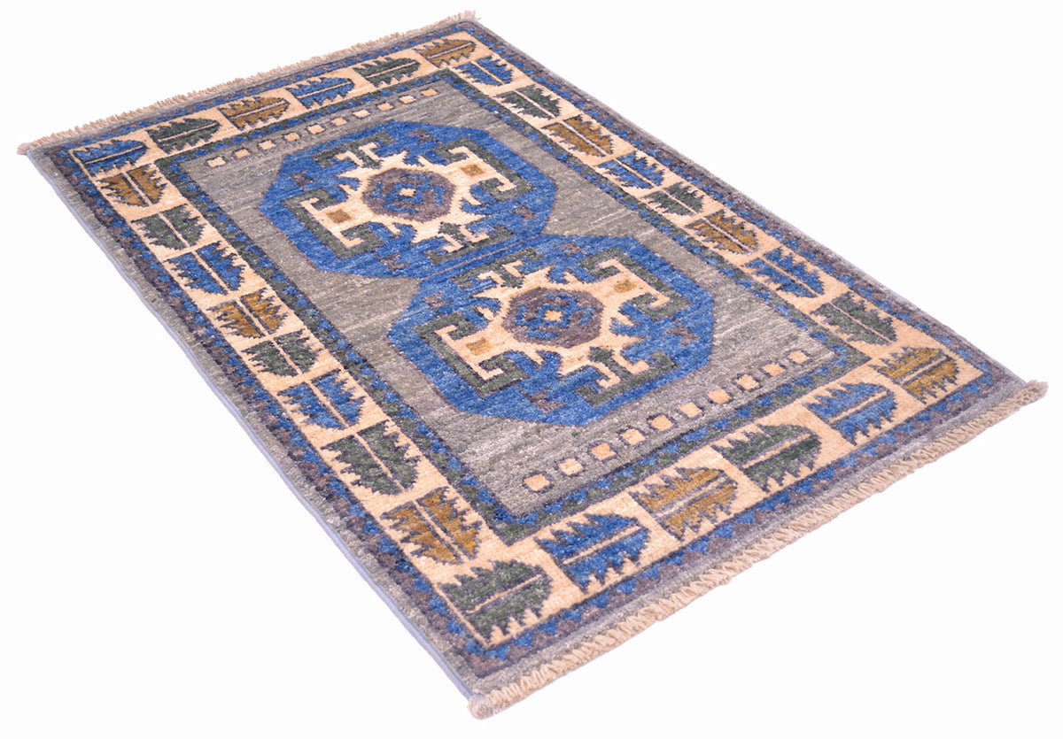 Angled view of Afghan mat with geometic Ushak design