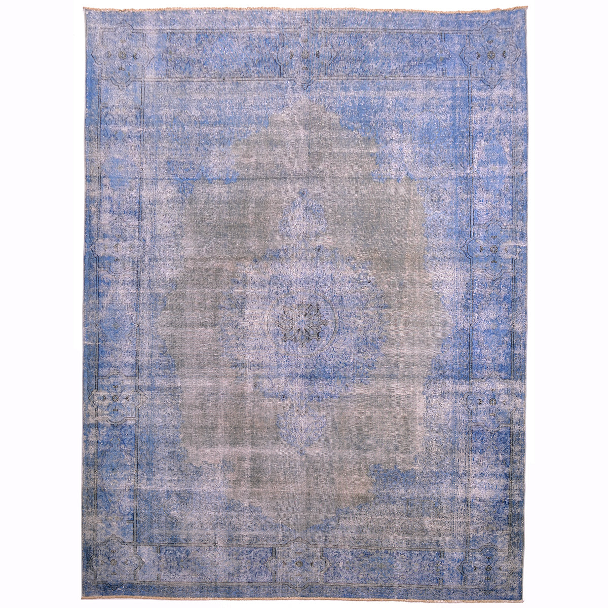 Vintage Overdyed carpet blue with medallion design and greysigh neutral field. Allover view of an old oriental carpet. Traditional border lineal patterning still visible. Distressed surface pile exposing warp and weft cotton foundation.