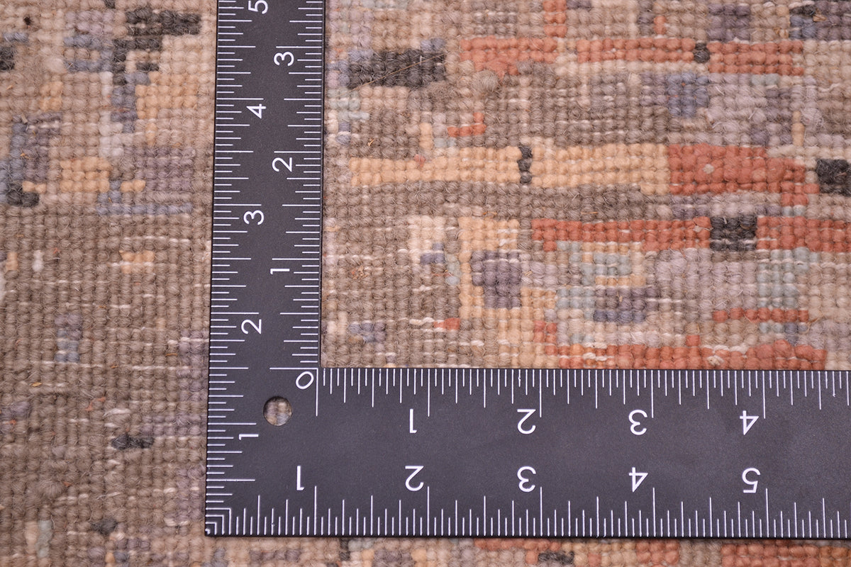 Reverse of handwoven Indian Carpet showing cotton wefts and back of knot of woollen and silk pile. Soft greys, light blues, taupes and light gold.