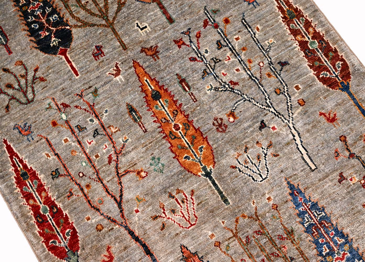 Pictorial Afghan Loribaft rug in grey with close-up of vertical tree rows in red, blue, and orange